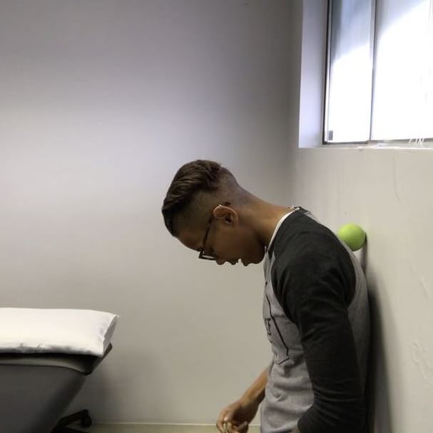 Wall Peel-off - Segmental Spinal Flexion in Standing with Tactile Cuing (Touch Your Toes Part 8)
